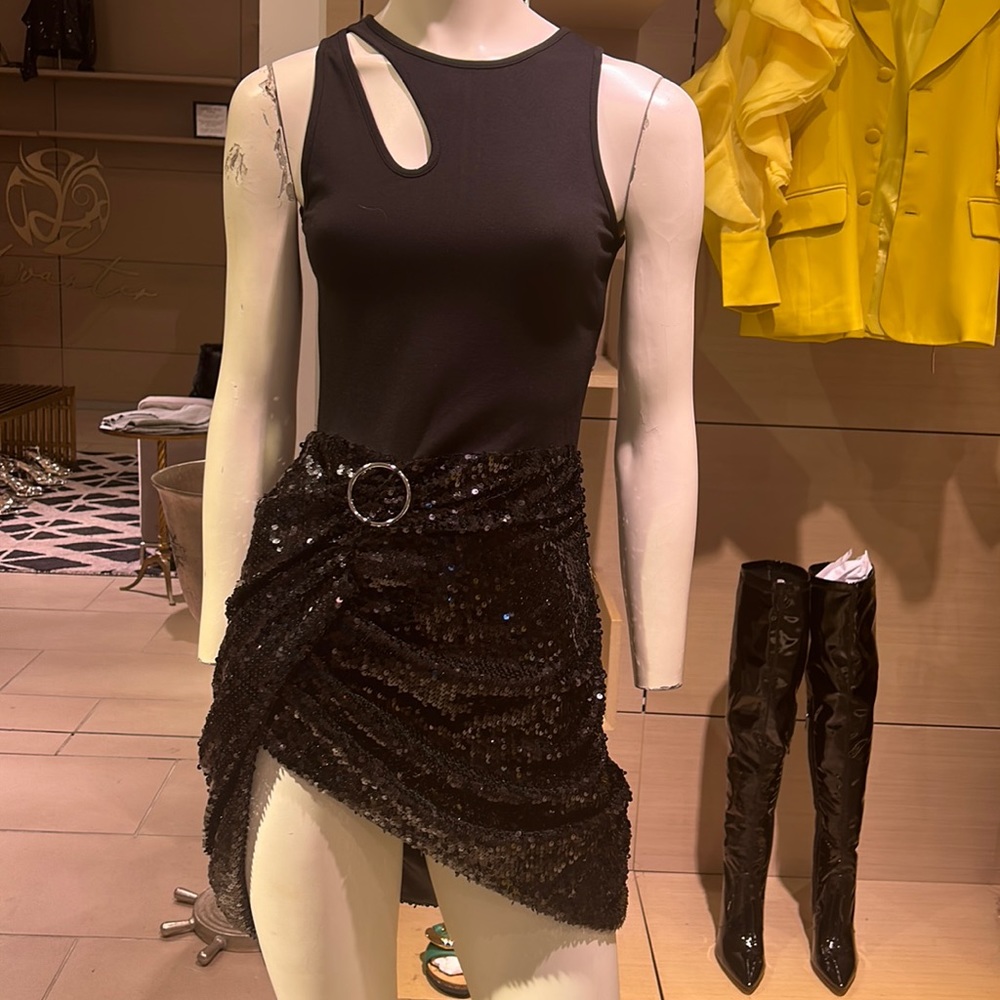 Fitted sleeveless mini dress with stretch fitted top and contrast sequin skirt.